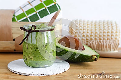 Homemade avocado mask. Prepared from mashed avocado and olive oil. Diy cosmetics. Stock Photo