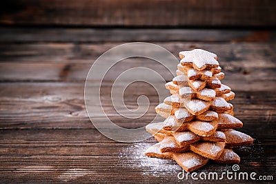 Homemade baked Christmas gingerbread tree with icing sugar Stock Photo