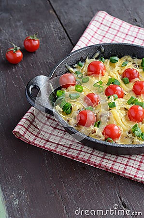 Homemade baked minced meat with cheese and cherry tomatoes Stock Photo