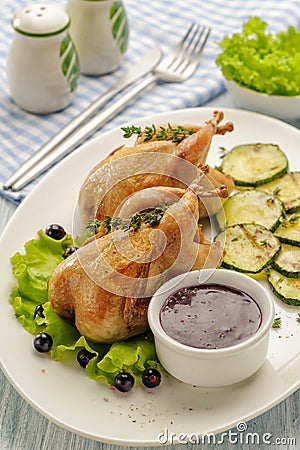 Homemade baked quails Stock Photo