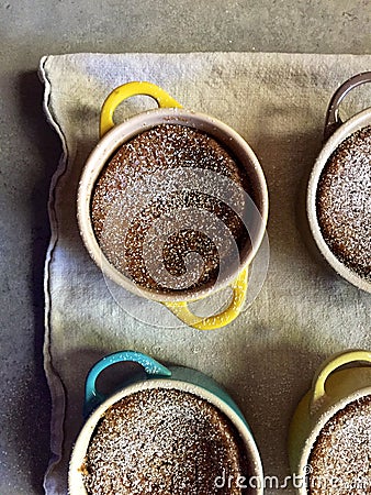 Homemade baking: gluten-free pumpkin custards in ramekins with spoon Stock Photo