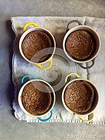 Homemade baking: gluten-free pumpkin custards in ramekins with spoon Stock Photo