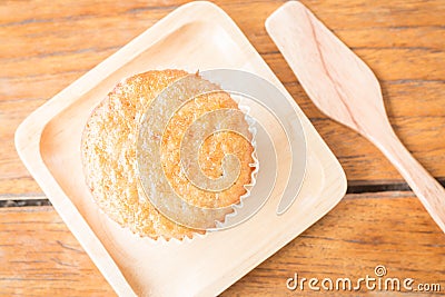 Homemade banana cupcake on wooden plate Stock Photo