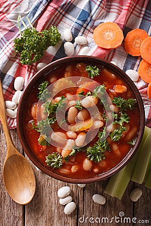 Homemade bean soup, carrots and celery close-up. vertical top vi Stock Photo