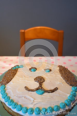 Homemade birthday cake in a shape of a dog face Stock Photo