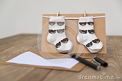 Birth greeting card with baby socks Stock Photo