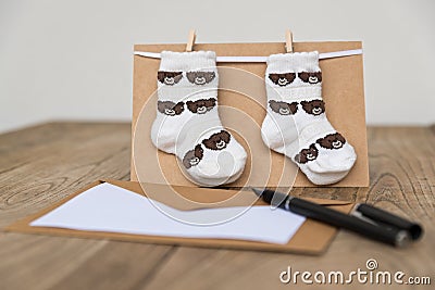 Birth greeting card with baby socks Stock Photo