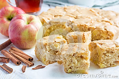 Homemade blondie (blonde) brownies apple cake, square slices on parchment Stock Photo