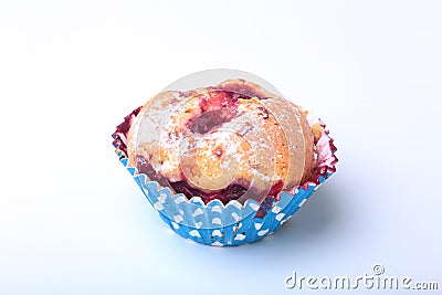 Homemade Blueberry muffins with powdered sugar and fresh berries. Stock Photo