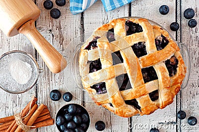 Homemade blueberry pie, top view baking scene over a white wood background Stock Photo