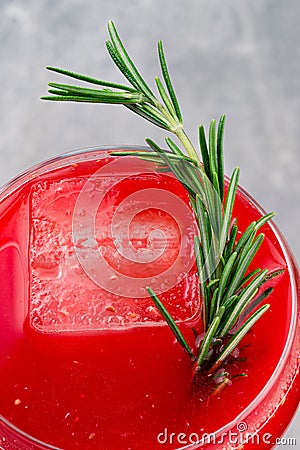 Homemade boozy alcoholic pomegranate cocktail with rosemary and vodka, copy space top view Stock Photo