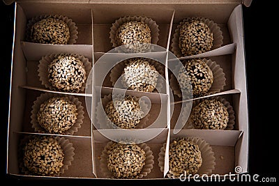 Homemade box filled with useful round handmade candy with sesame seeds Stock Photo