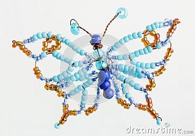 Homemade butterfly made of beads and wire macro Stock Photo