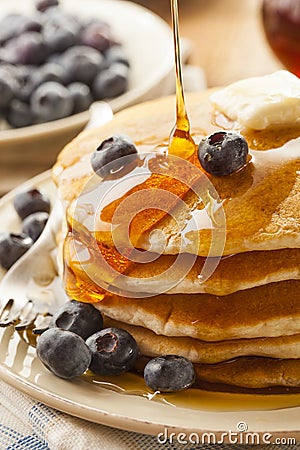 Homemade Buttermilk Pancakes with Blueberries and Syrup Stock Photo