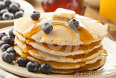 Homemade Buttermilk Pancakes with Blueberries and Syrup Stock Photo