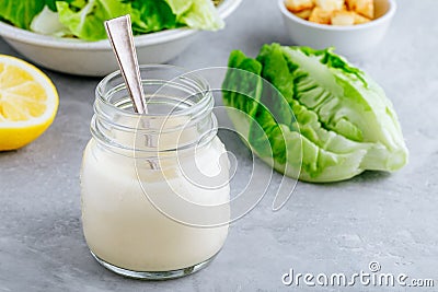 Homemade Caesar Salad Dressing in glass jar Stock Photo