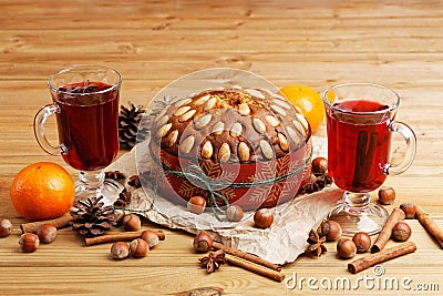 Homemade cake with almonds and two glasses with mulled wine Stock Photo