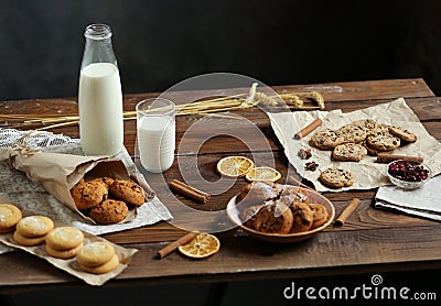 Homemade cakes and milk on a wooden table Stock Photo