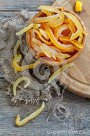 Homemade candied citrus fruit in a wooden bowl. Stock Photo