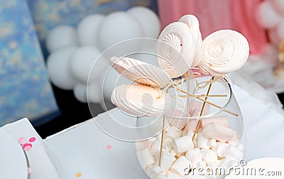 Homemade candies meringue on stick Meringue candy on wooden stick in vase on party Stock Photo