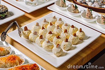 Homemade Cheese appetizer for Cretan. Cheese balls and nuts. Stock Photo