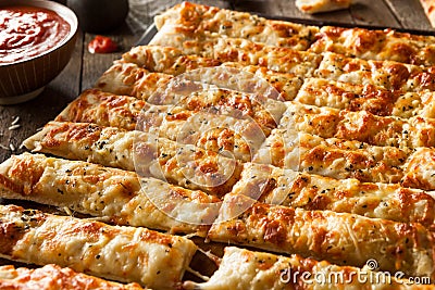 Homemade Cheesy Breadsticks with Marinara Stock Photo