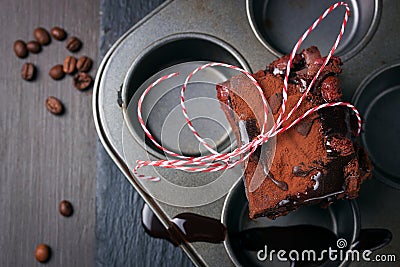 Homemade chocolate sweet brownies cakes with cherry and chocolate sauce or syrup on a dark background, horizontal Stock Photo