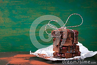 Homemade chocolate sweet brownies cakes with cherry and chocolate sauce or syrup on a dark background, horizontal Stock Photo