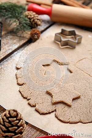 Homemade Christmas biscuits. Dough and cookie cutter on table, closeup Stock Photo