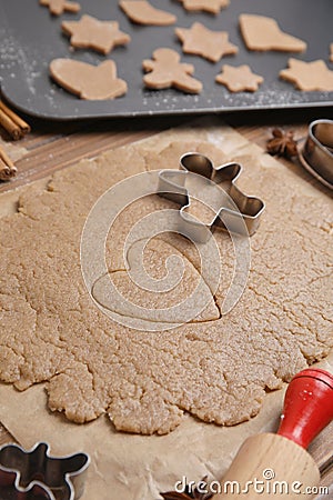 Homemade Christmas biscuits. Dough and cookie cutters on table Stock Photo