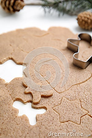 Homemade Christmas biscuits. Raw dough and cookie cutter on white table, closeup Stock Photo