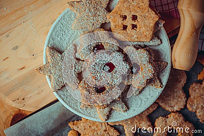 Homemade Christmas gingerbread and linzer cookies with jam, powdered, top flat view, instagram filetr, vintage Stock Photo