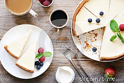 Homemade classical New York cheesecake and coffee on wooden table Stock Photo