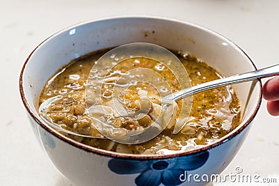 Homemade Curried Lentil Soup with Turkish Noodle Eriste in Spoon Stock Photo