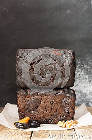 Homemade dessert bread with malt, prunes,walnuts, flour starter, long fermentation. The bread has an ugly, cracked crust Stock Photo