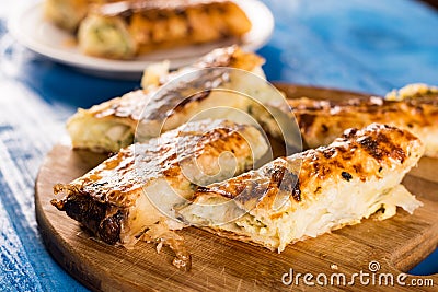 Homemade domestic cheese pie sliced and served on the table Stock Photo