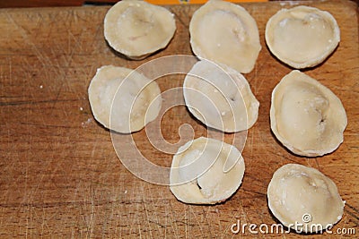 Homemade dumplings molded by hand meat in dough Stock Photo