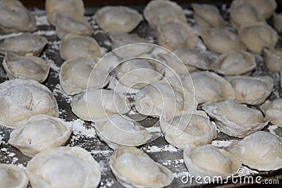 Homemade dumplings molded by hand meat in dough Stock Photo