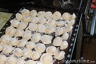 Homemade dumplings molded by hand meat in dough Stock Photo