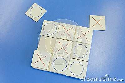 Homemade educational wooden tic-tac-toe game Stock Photo