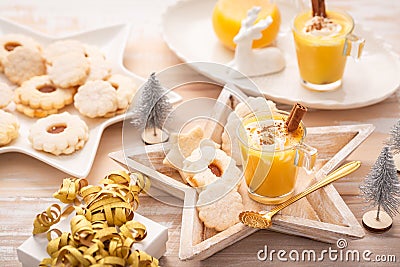 Homemade eggnog, egg liqueur for Christmas with small cookies Stock Photo