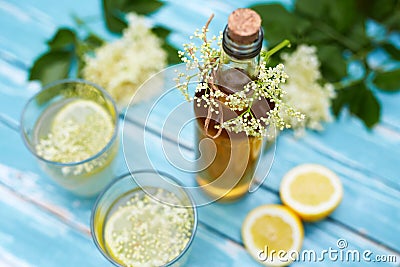 Homemade elderflower syrup in a bottle with elderflowers Stock Photo