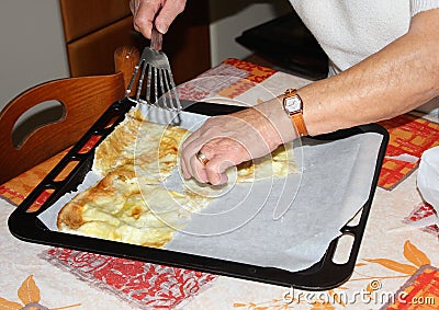 The homemade Farinata is ready to serve on the table. Stock Photo