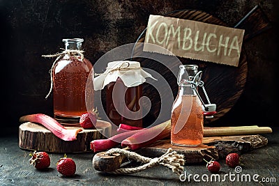 Homemade fermented strawberry and rhubarb kombucha. Healthy natural probiotic flavored drink. Stock Photo