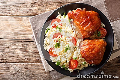 Homemade food: baked chicken thighs with garnish of rice close u Stock Photo