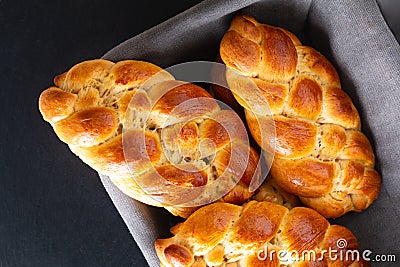 Homemade food concept fresh baked bread braid challah dough in bread basket with copy space Stock Photo