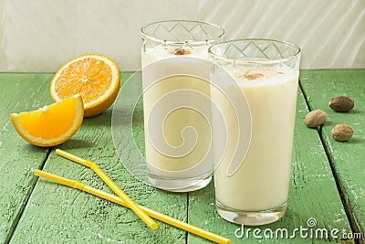 Homemade fresh milkshake with orange, ice cream and nutmeg Stock Photo