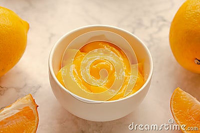 Homemade fresh pudding or tangy lemon curd in a white bowl.Selective focus Stock Photo