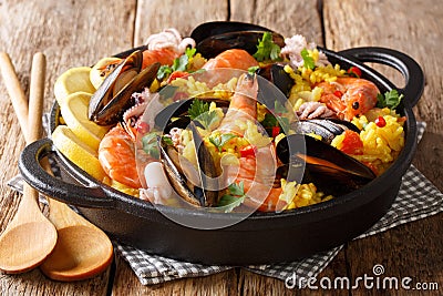 Homemade freshly prepared paella with king prawns, mussels, fish Stock Photo