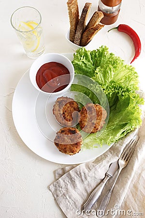 Homemade fried chicken meat cutlets with salade leaves , lettuce and sauce Stock Photo